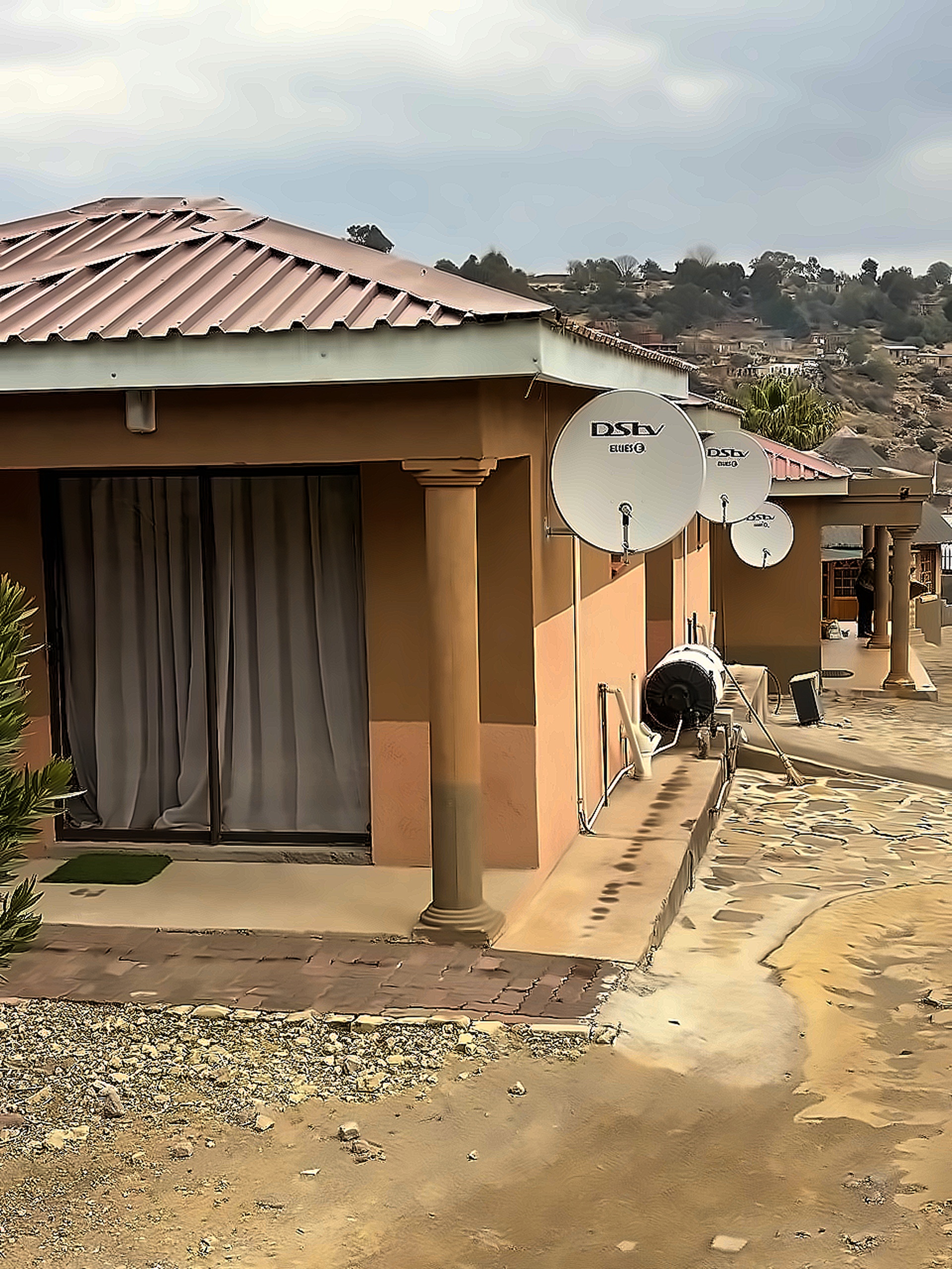 Private guest room exterior with satellite dish and veranda